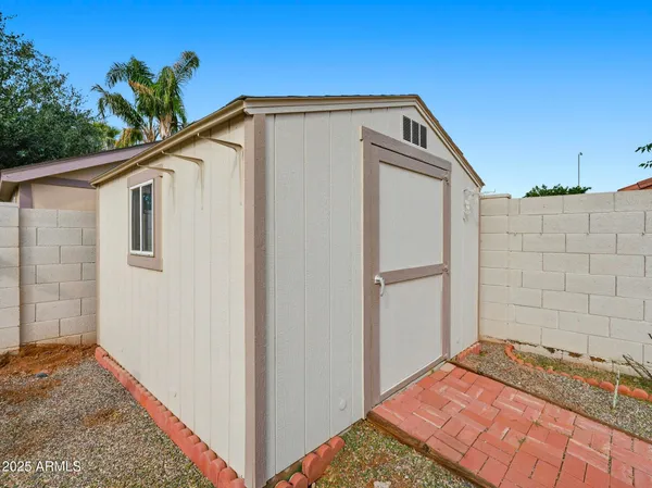 a view of front door and yard
