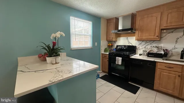 a kitchen with a sink a counter cabinets and appliances