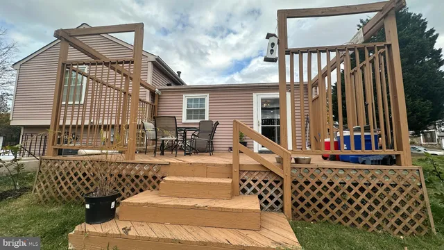 a view of a chair and tables on the wooden floor