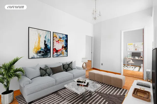 a living room with furniture a couch and paintings on the wall