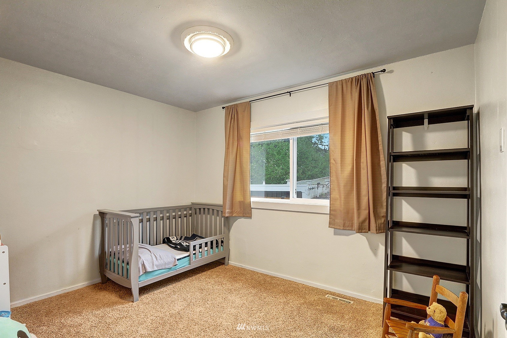 2209 Northeast 8th Street Renton, WA 98056 - Photo 15 of 24 a living room with furniture and a window
