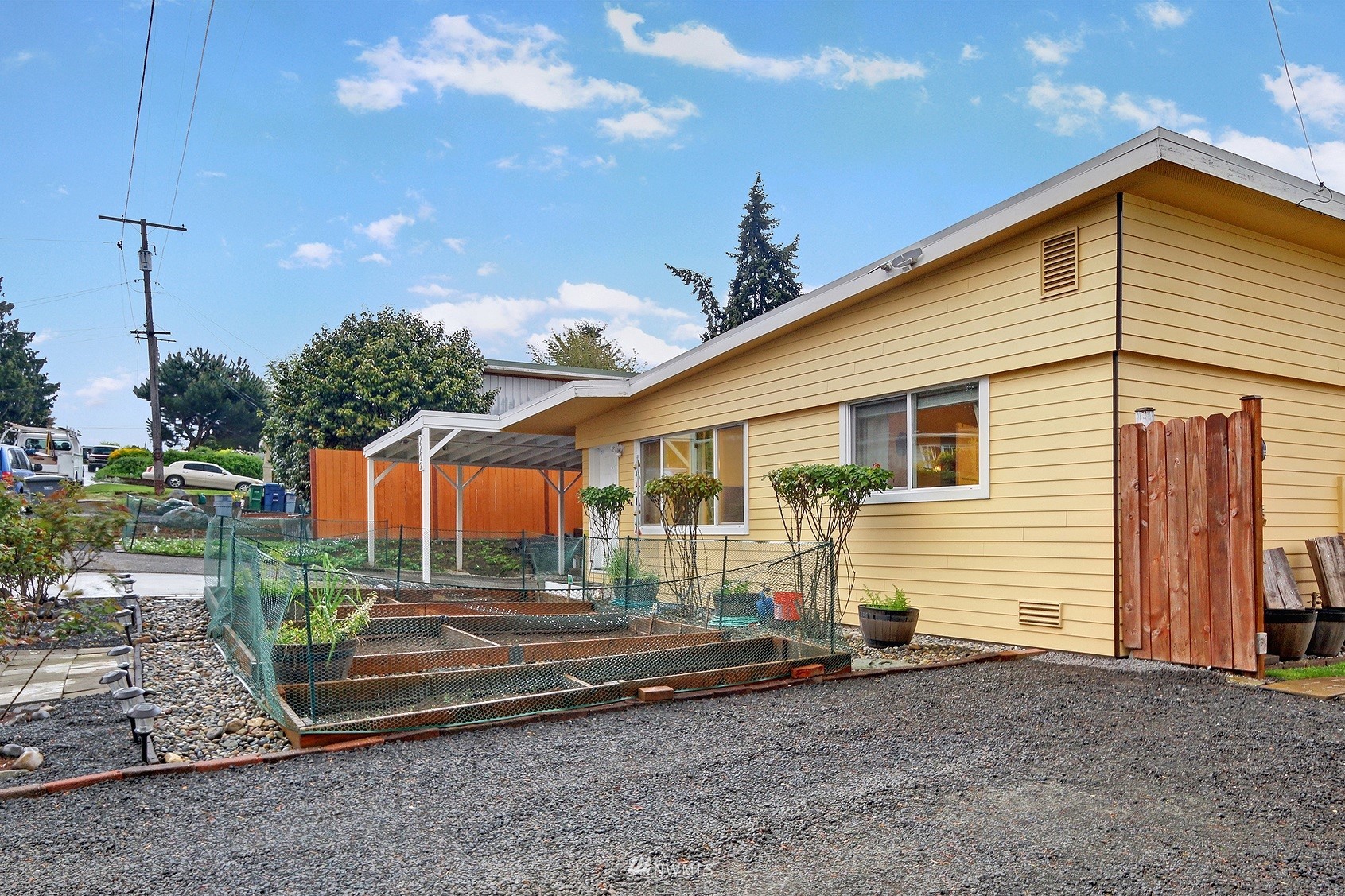 2209 Northeast 8th Street Renton, WA 98056 - Photo 18 of 24 a front view of a house with a yard