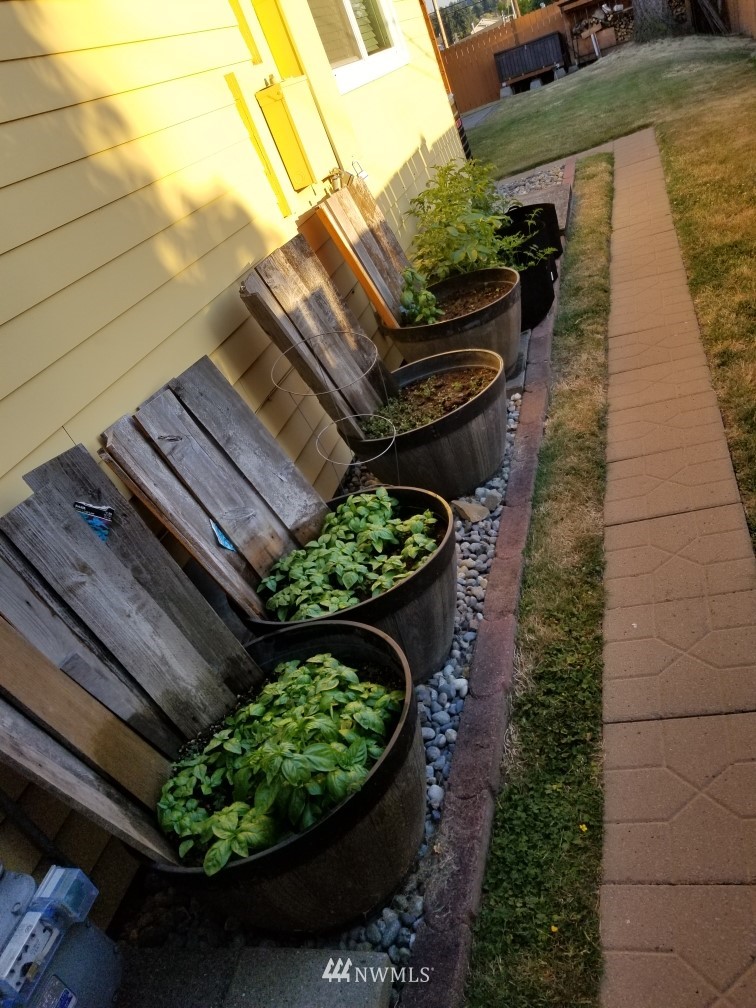 2209 Northeast 8th Street Renton, WA 98056 - Photo 22 of 24 a view of a backyard with sitting area