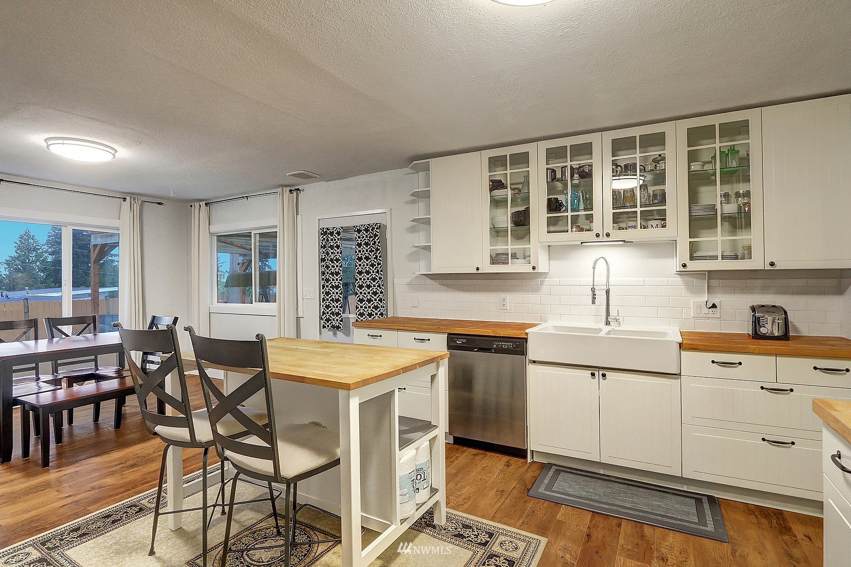 2209 Northeast 8th Street Renton, WA 98056 - Photo 4 of 24 a kitchen with a sink and cabinets