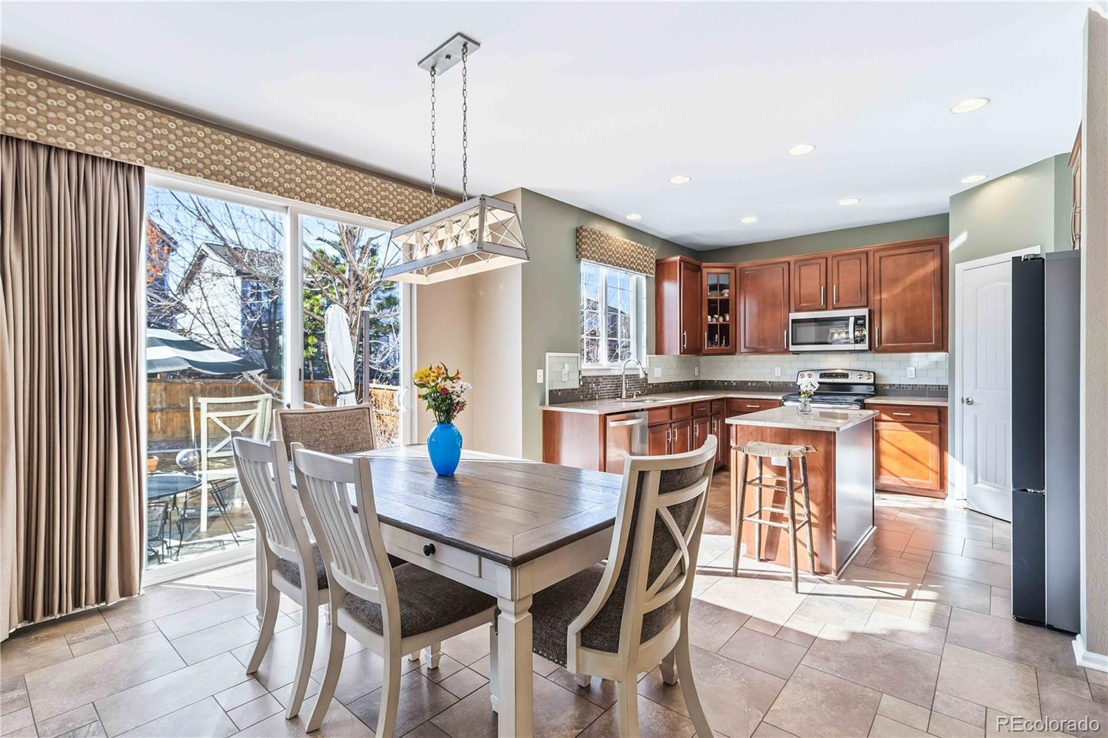 14144 Greenfield Loop Parker, CO 80134 - Photo 12 of 50 a view of a dining room and livingroom view