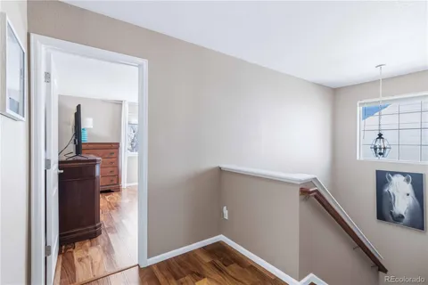 a bedroom with a bed lamp and window