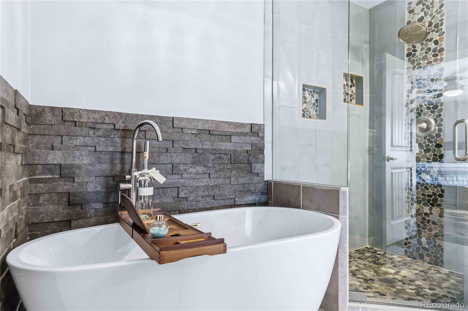 14144 Greenfield Loop Parker, CO 80134 - Photo 24 of 50 a bath tub sitting in a bathroom