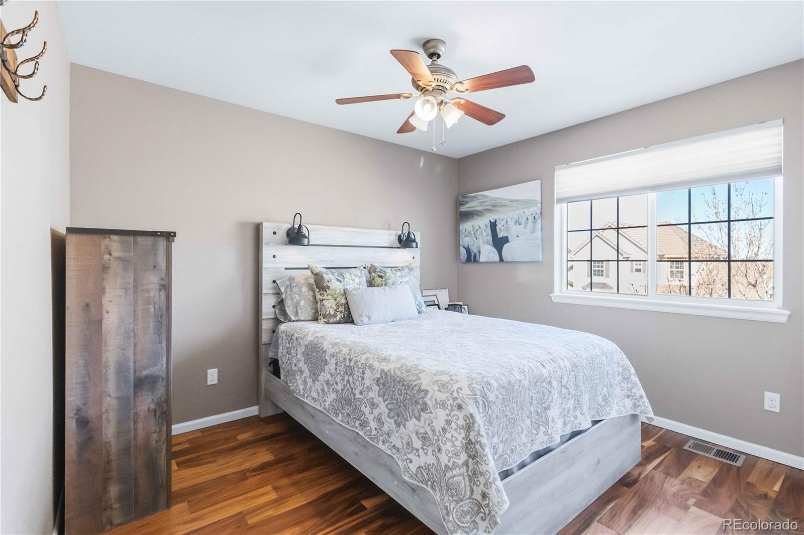 14144 Greenfield Loop Parker, CO 80134 - Photo 30 of 50 a bedroom with a large bed and a window