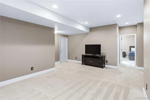 a bathroom with a sink toilet vanity and shower
