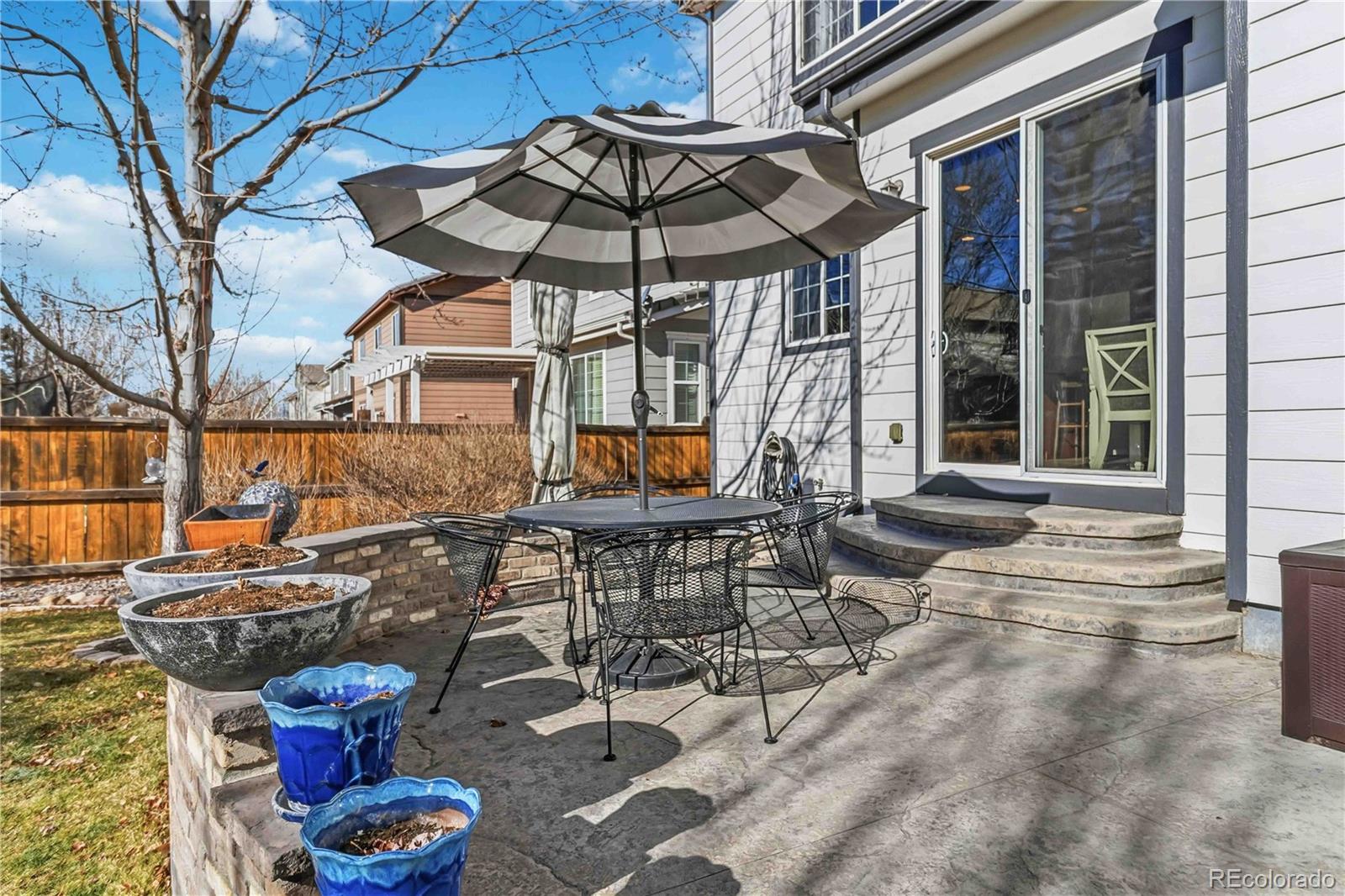 14144 Greenfield Loop Parker, CO 80134 - Photo 39 of 50 a patio with sofas fire pit and outdoor seating