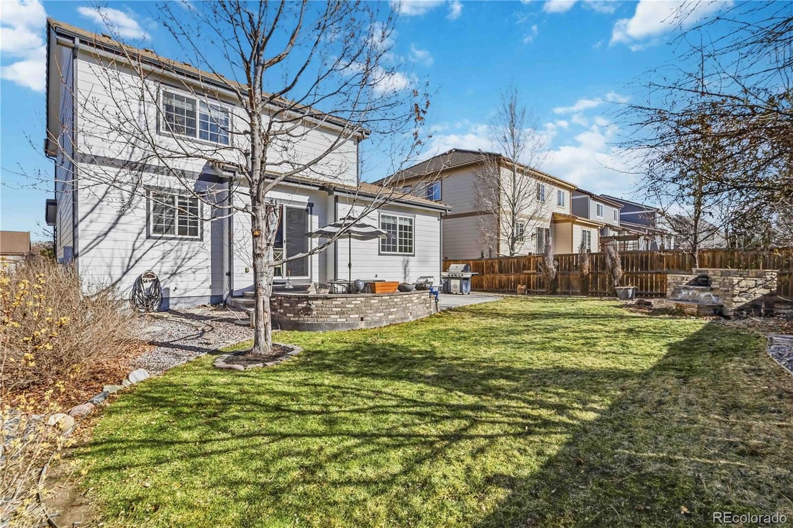 14144 Greenfield Loop Parker, CO 80134 - Photo 41 of 50 a view of a house with a yard