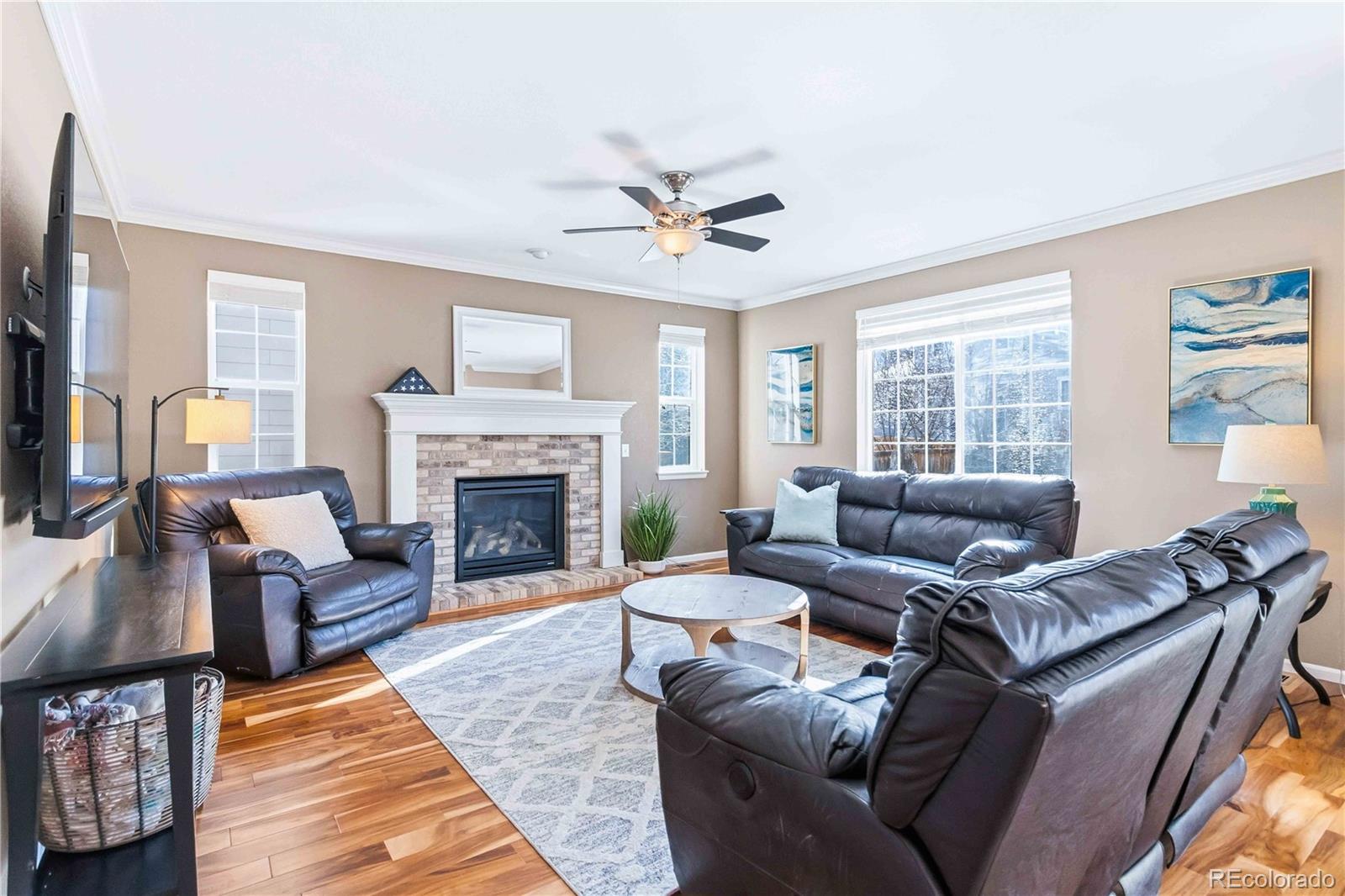 14144 Greenfield Loop Parker, CO 80134 - Photo 8 of 50 a living room with furniture and a fireplace