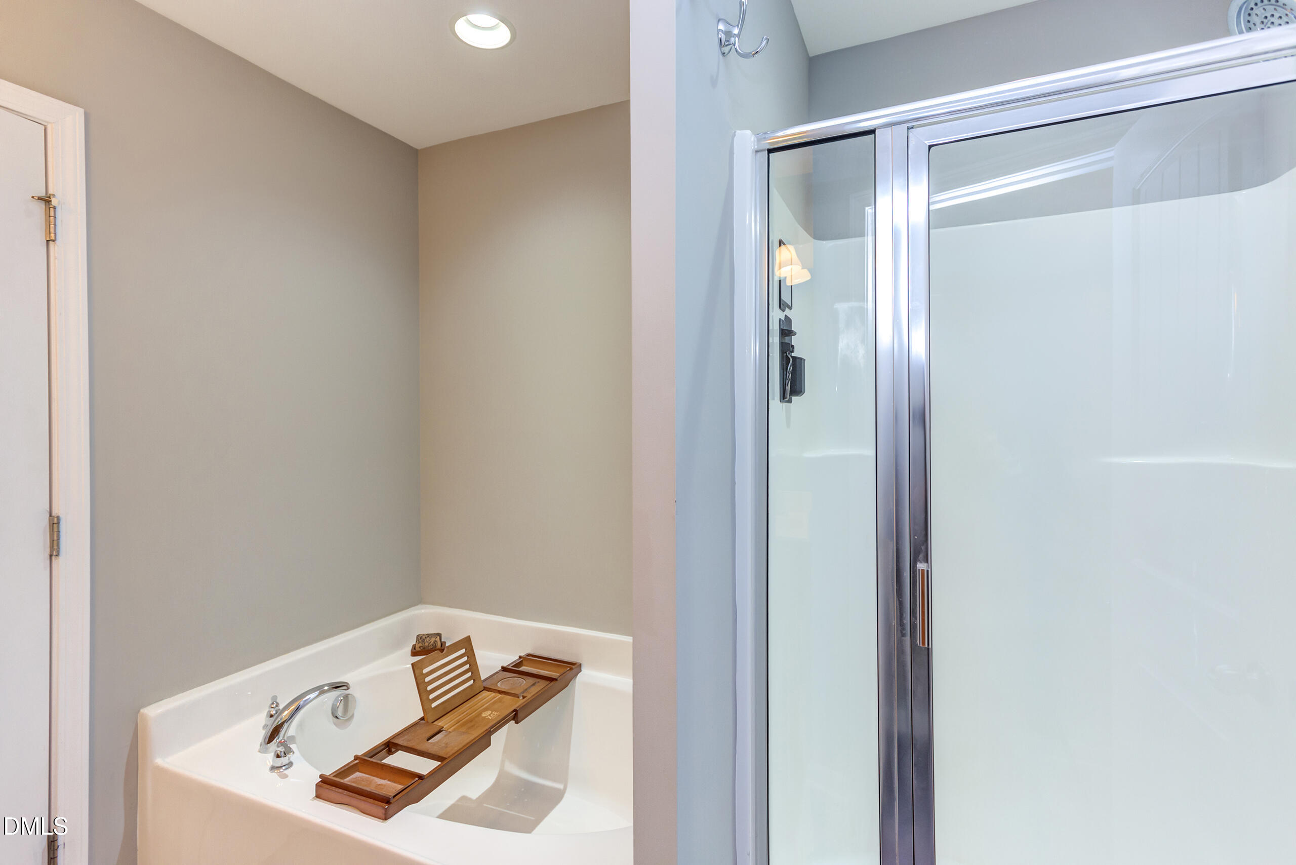 1434 Chatuga Way Wake Forest, NC 27587 - Photo 20 of 29 a bathroom with a bathtub and shower