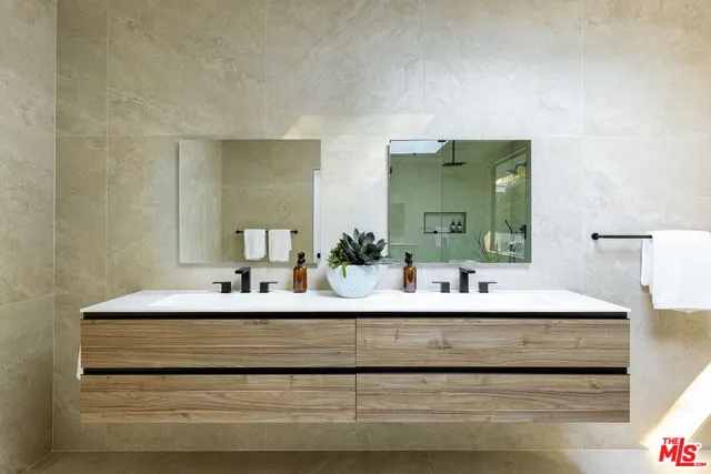 a spacious bathroom with a bathtub and sink