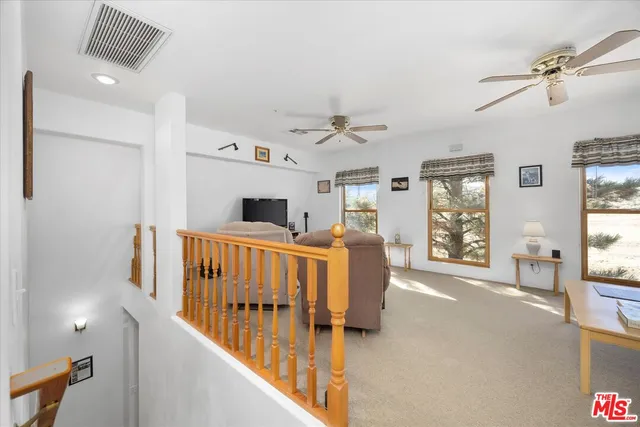 a living room with furniture fireplace and a flat screen tv