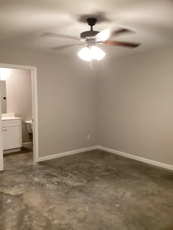 a bathroom with a toilet and a bath tub