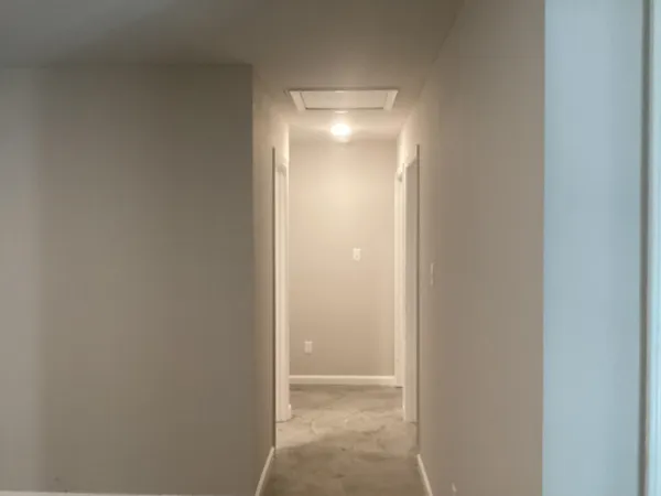 an empty room with a empty space and window