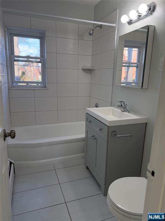 270 Oak Street, Unit B2 Ridgewood, NJ 07450 - Photo 4 of 5 a bathroom with a sink a toilet and shower