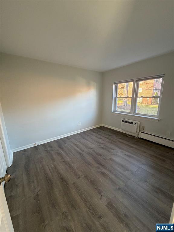 270 Oak Street, Unit B2 Ridgewood, NJ 07450 - Photo 5 of 5 an empty room with wooden floor and windows