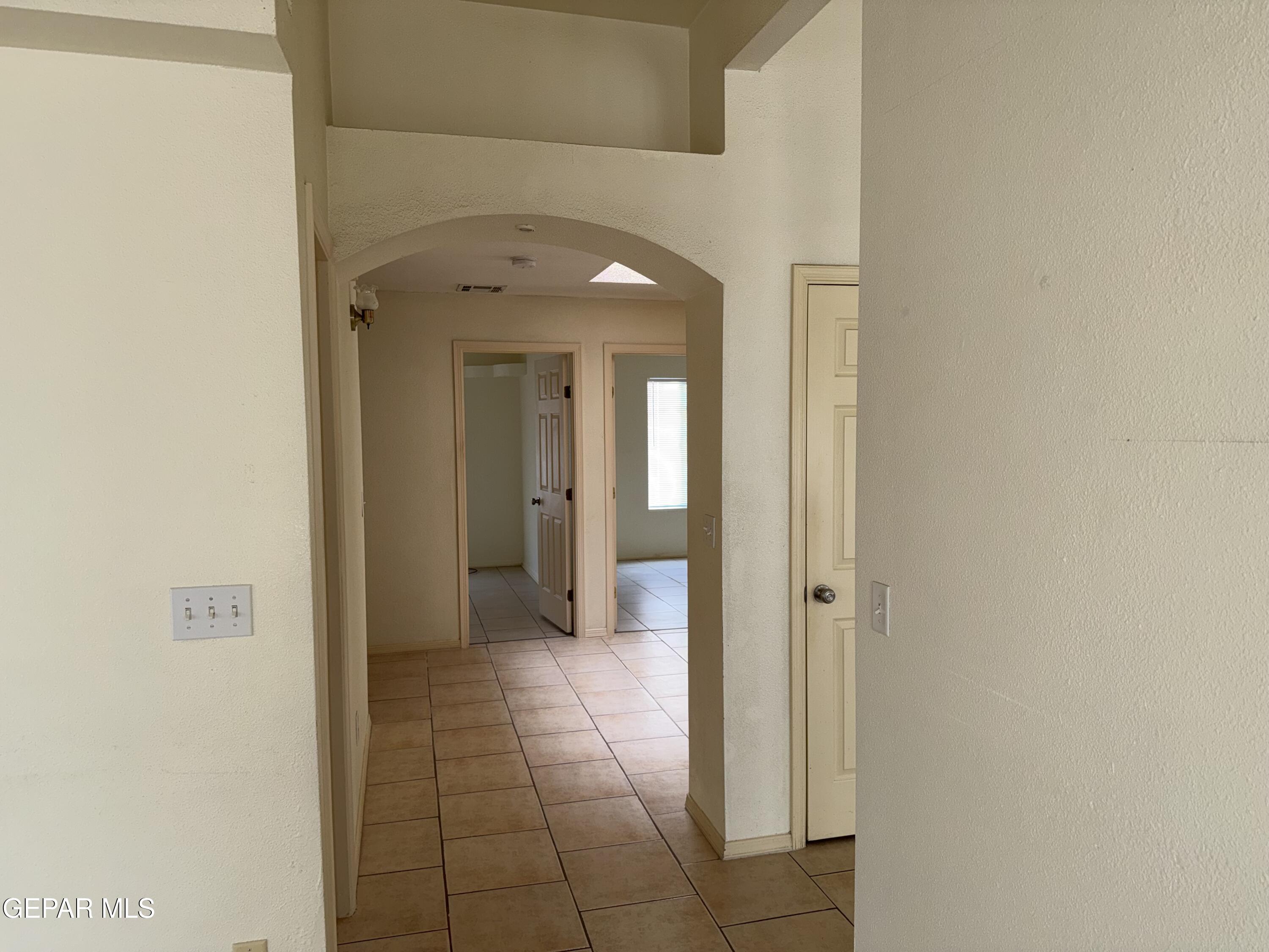 456 Passmore Road Socorro, TX 79927 - Photo 8 of 23 a view of a hallway with wooden shelves