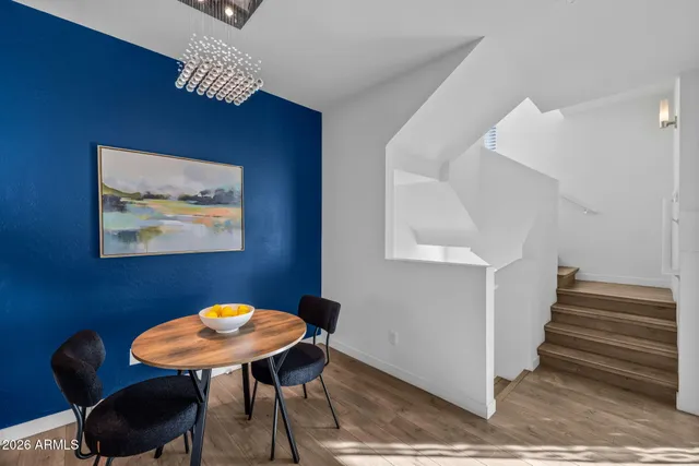 a view of a patio with swimming pool table and chairs