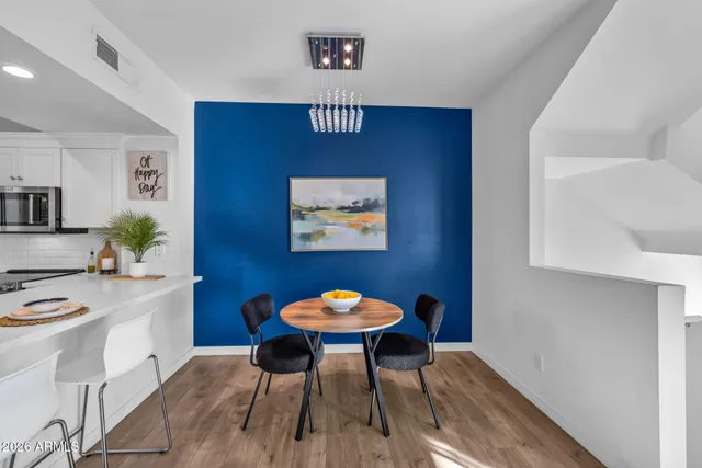 a house view with outdoor seating space and swimming pool