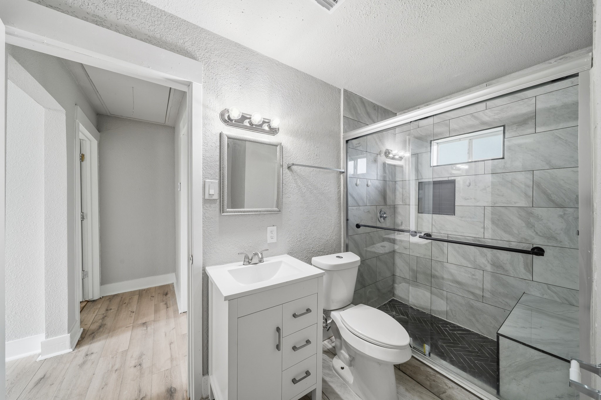 1718 Miami Road Pasadena, TX 77502 - Photo 7 of 11 a bathroom with a toilet sink and a mirror