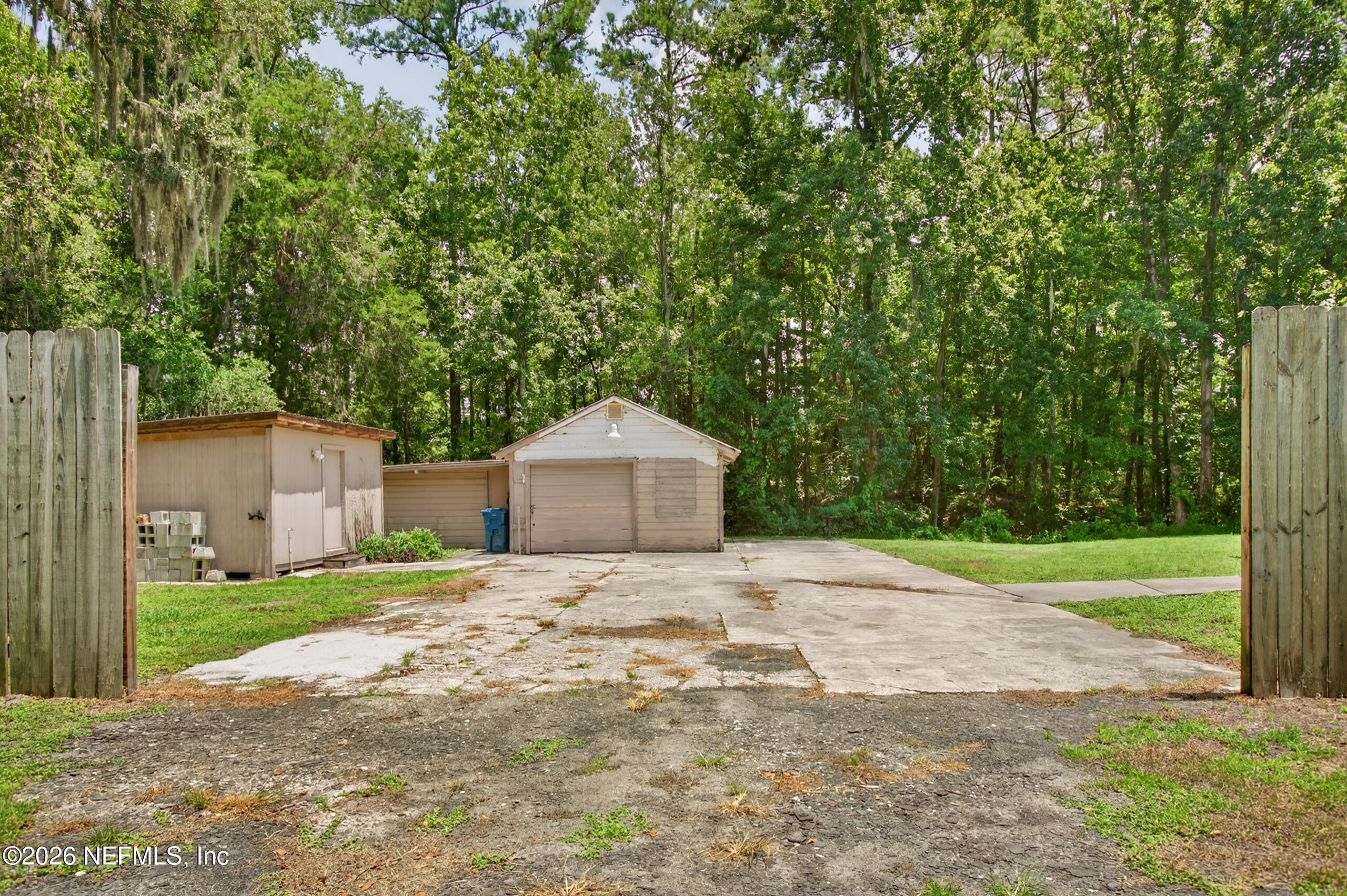 2817 Haddock Road Jacksonville, FL 32218 - Photo 53 of 77 Driveway to Garage and Storage Shed