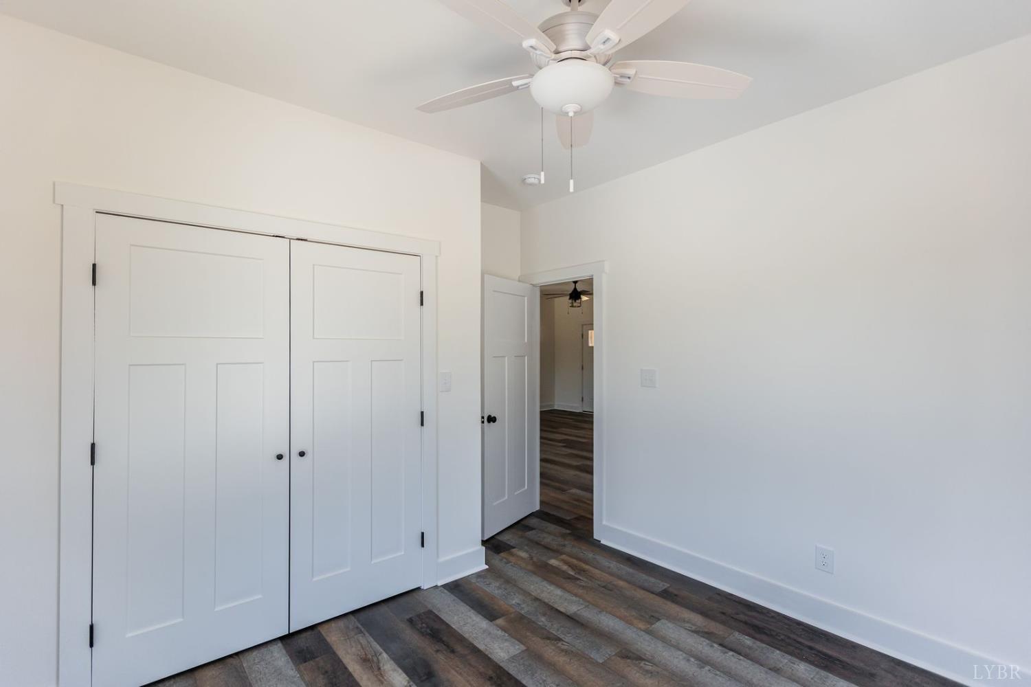 9740 Oakville Road Gladstone, VA 24553 - Photo 52 of 75 a view of an empty room with wooden floor
