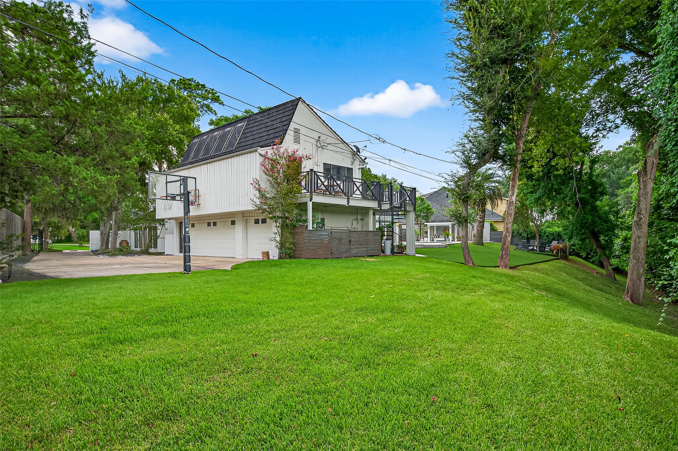 415 Ramblewood Road Houston, TX 77079 - Photo 42 of 49 Look at the size of this yard! It backs to the Terry Hershey Park ravine, so no back neighbors! Notice the 3 car garage and lots of space for extra parking.