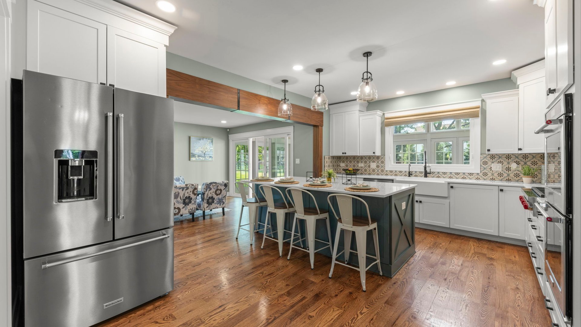 3614 Wolf Road Oswego, IL 60543 - Photo 16 of 56 a kitchen with stainless steel appliances granite countertop a refrigerator a sink dishwasher a stove and white cabinets with wooden floor