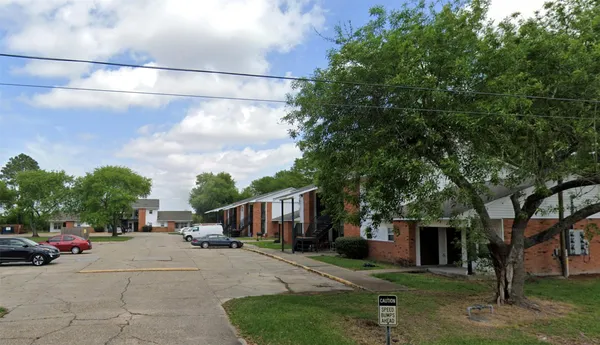 a view of street with parked cars