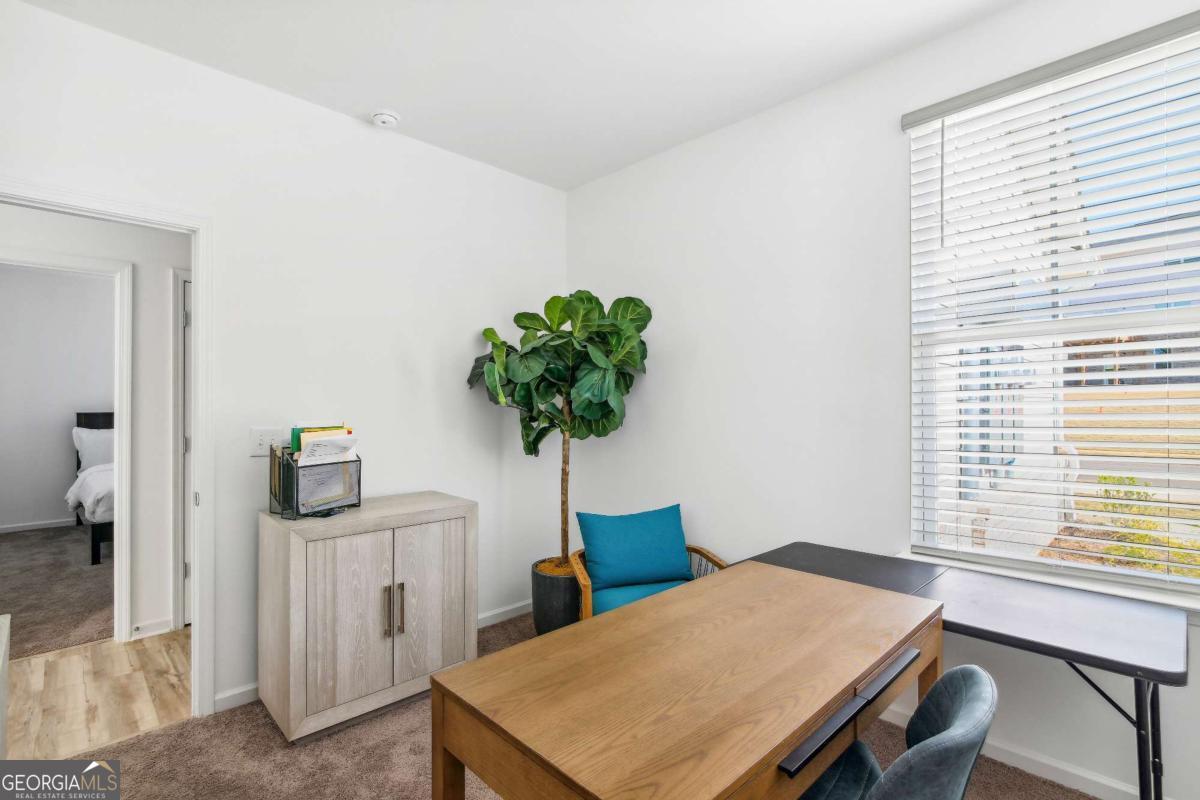 1569 Salinger Court Stockbridge, GA 30281 - Photo 20 of 26 a room with furniture and a window