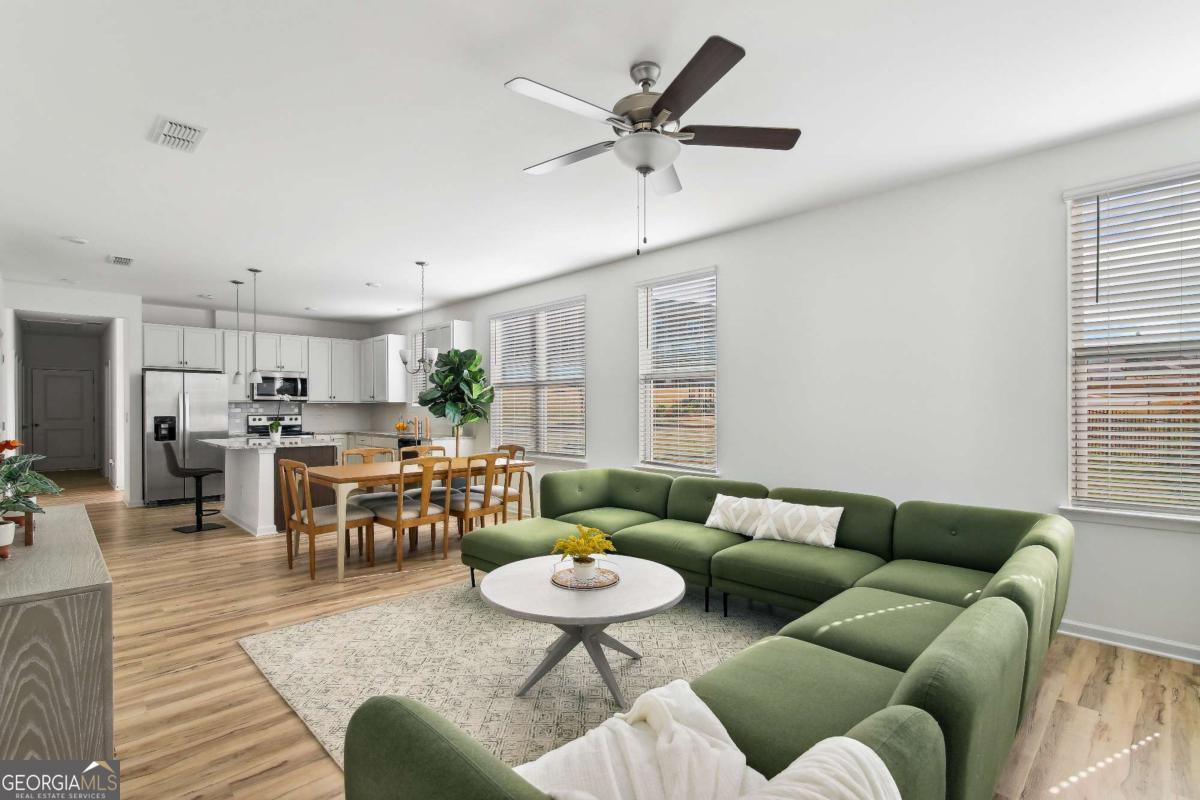 1569 Salinger Court Stockbridge, GA 30281 - Photo 4 of 26 a living room with furniture kitchen view and a large window
