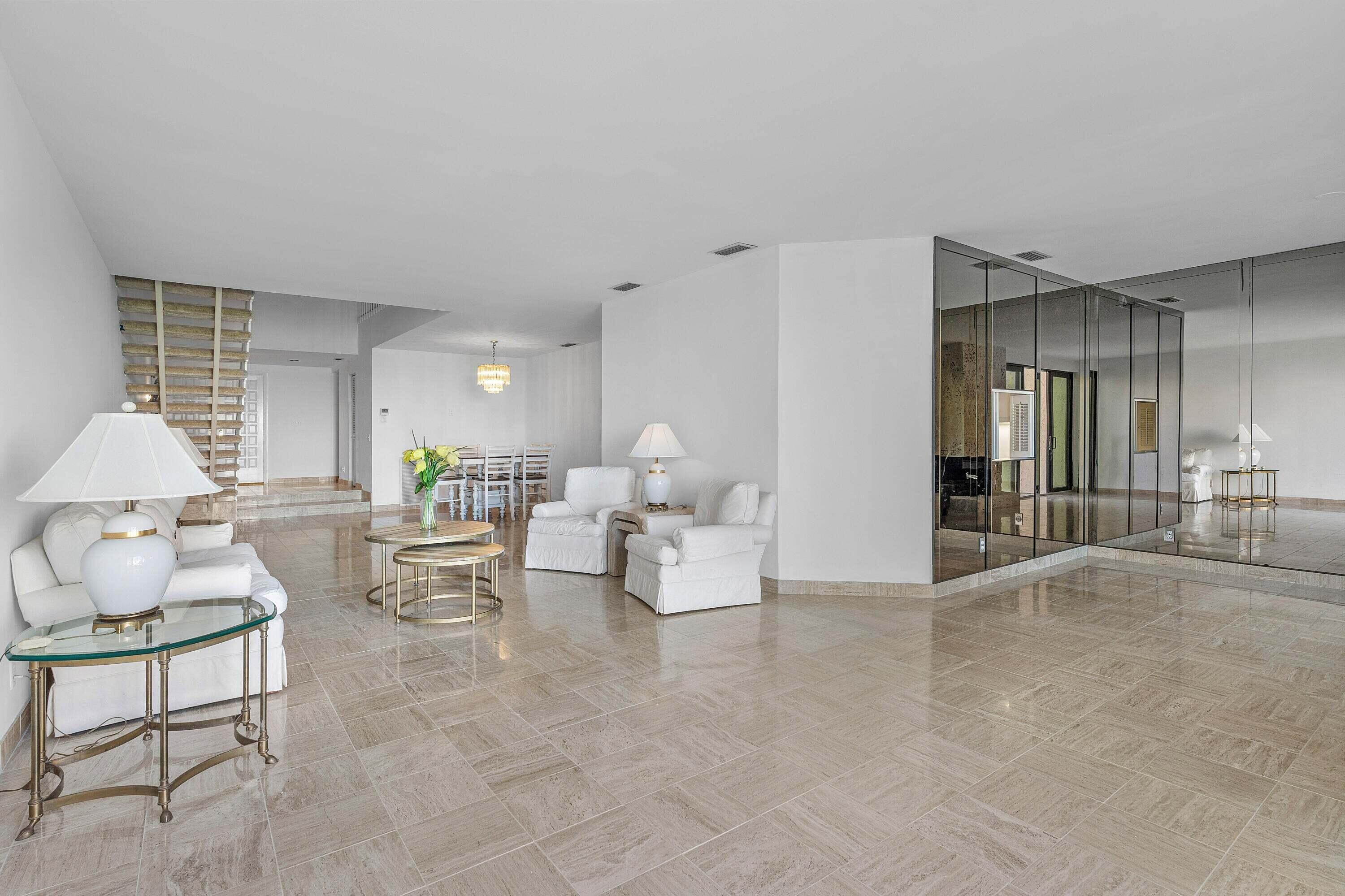 6711 North Ocean Boulevard, Unit 13 Ocean Ridge, FL 33435 - Photo 15 of 50 a living room with furniture and white walls