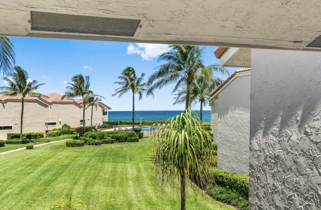 6711 North Ocean Boulevard, Unit 13 Ocean Ridge, FL 33435 - Photo 8 of 50 a view of outdoor space with garden
