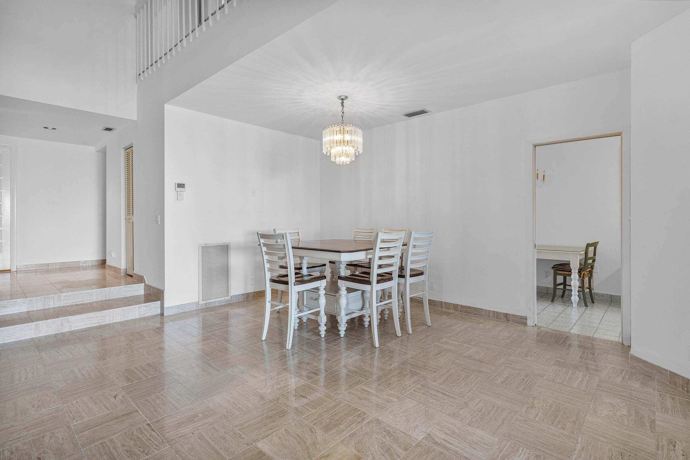 6711 North Ocean Boulevard, Unit 13 Ocean Ridge, FL 33435 - Photo 10 of 50 a view of a dining room with furniture window and outside view