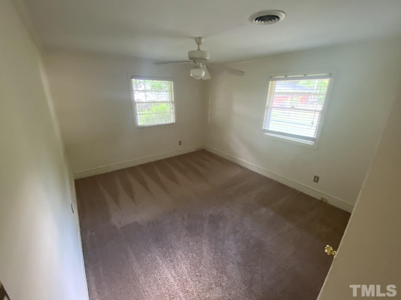 1418 Lyon Street Raleigh, NC 27608 - Photo 9 of 11 an empty room with windows