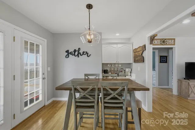a bedroom with a bed and a flat tv screen on the dresser