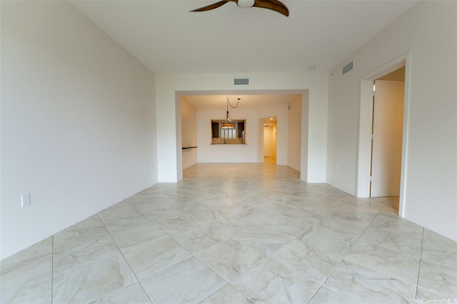 501 Kailua Road, Unit 1205 Kailua, HI 96734 - Photo 4 of 25 Vacant view living room boasting the open floor plan
