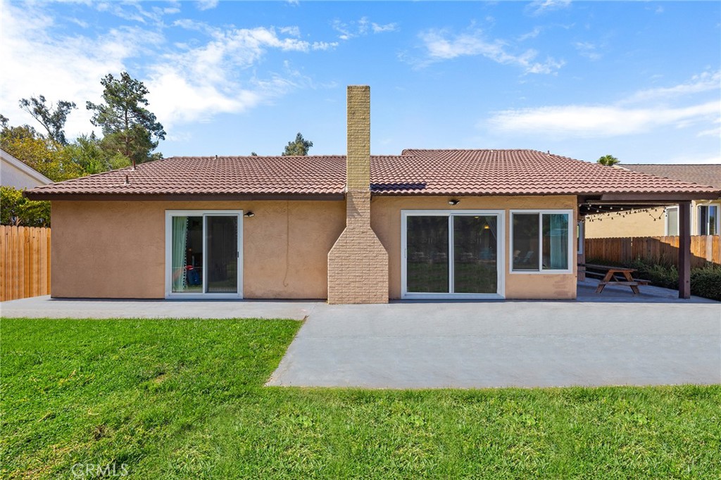 29951 Cactus Place Temecula, CA 92592 - Photo 27 of 46 a front view of a house with a yard and garage