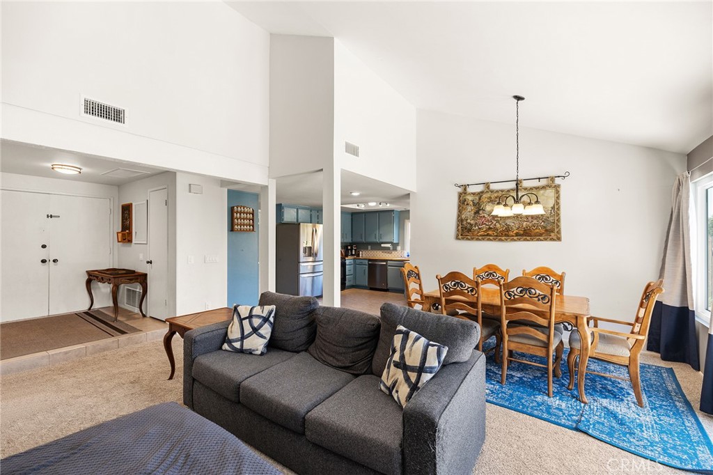 29951 Cactus Place Temecula, CA 92592 - Photo 7 of 46 a living room with furniture kitchen view and a chandelier