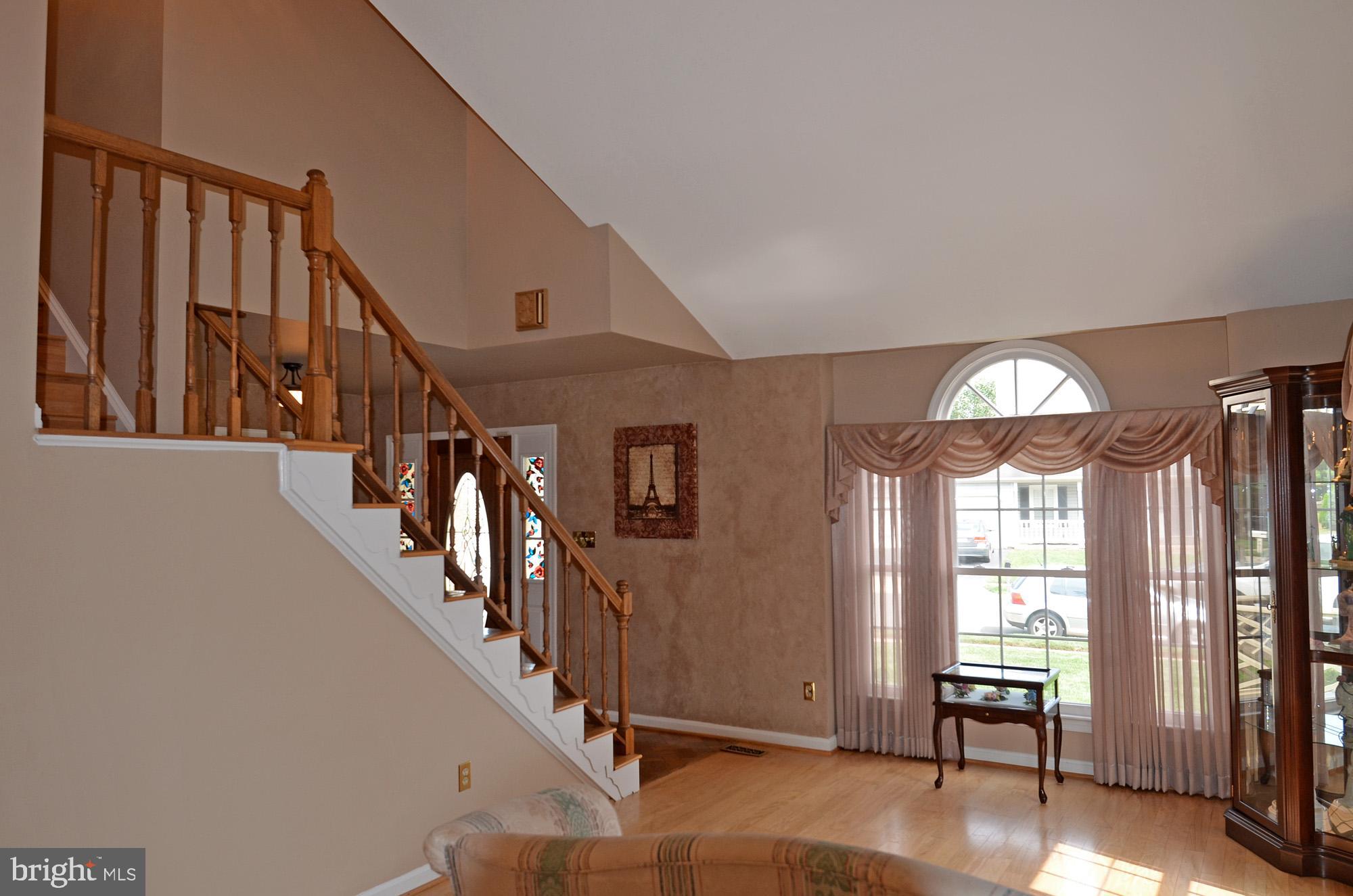 5819 Stone Ridge Drive Centreville, VA 20120 - Photo 22 of 72 Living room with hardwood floor & Palladian window
