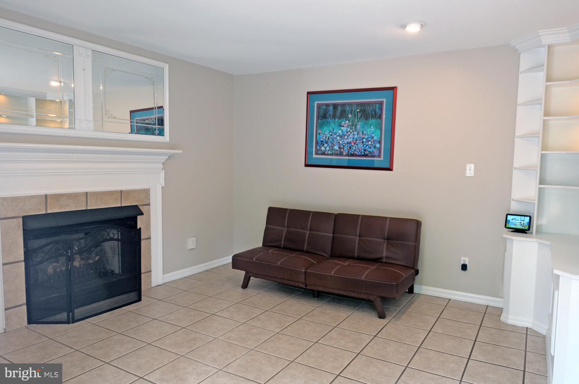 5819 Stone Ridge Drive Centreville, VA 20120 - Photo 43 of 72 Family room w/tile floor & 2 sets of built-ins