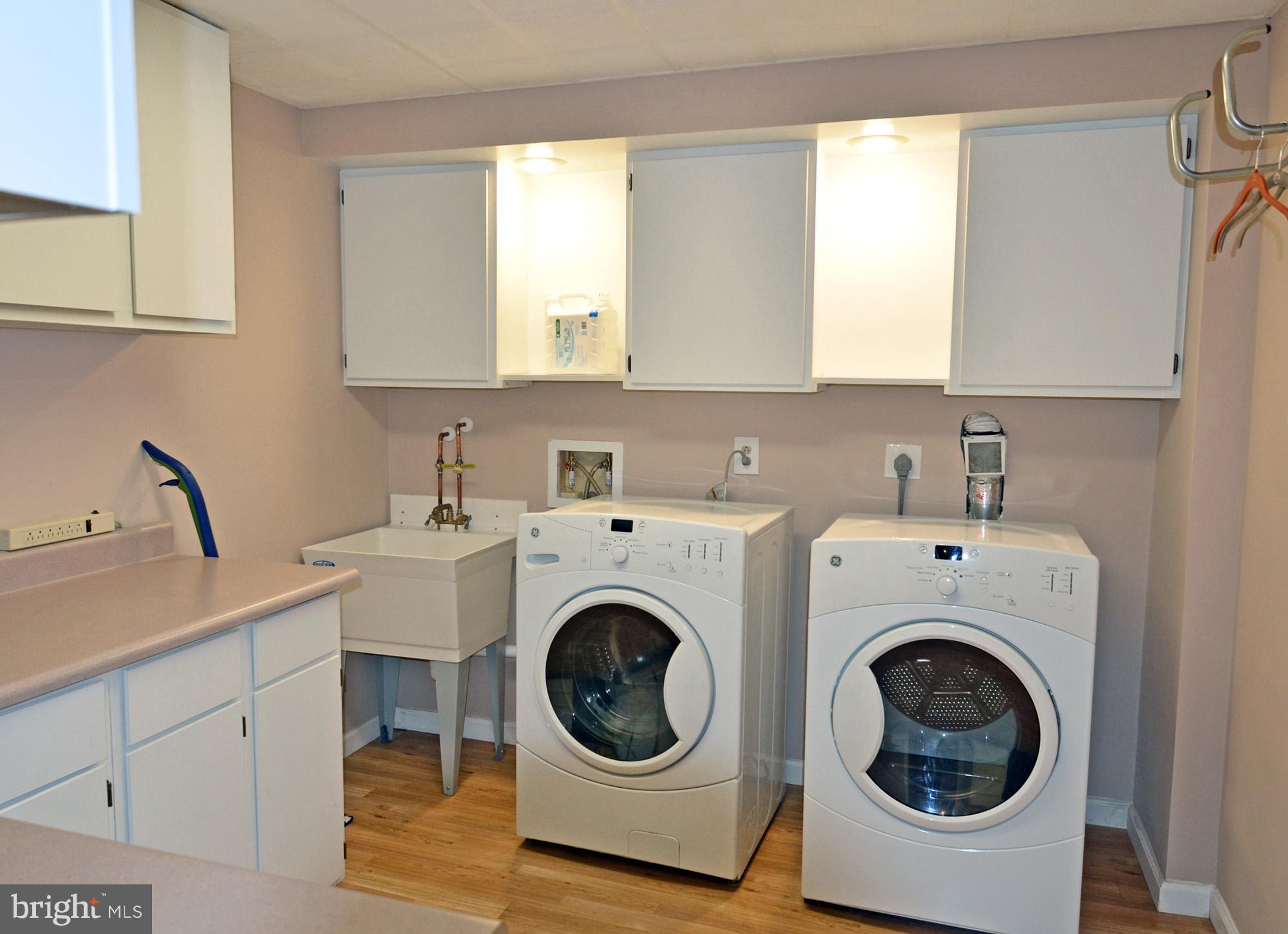5819 Stone Ridge Drive Centreville, VA 20120 - Photo 66 of 72 Laundry rm w/cabinet/counter space & washer/dryer