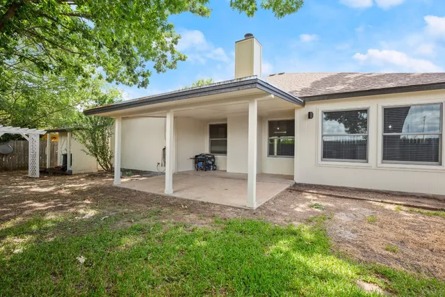 a backyard of a house with seating space