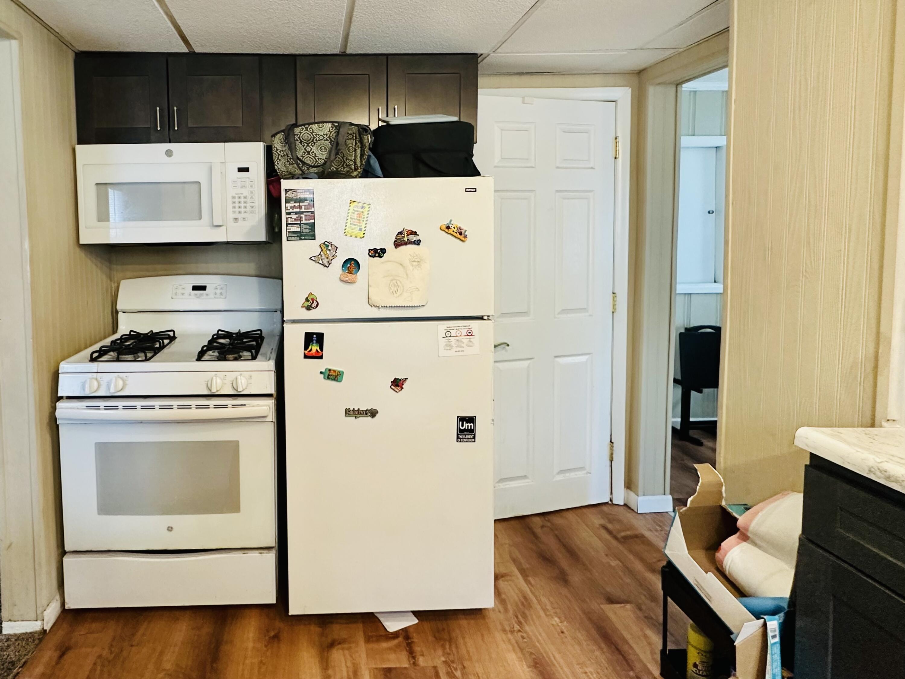 5856 Wallace Road Hammond, IN 46320 - Photo 6 of 14 a white refrigerator freezer sitting in a kitchen