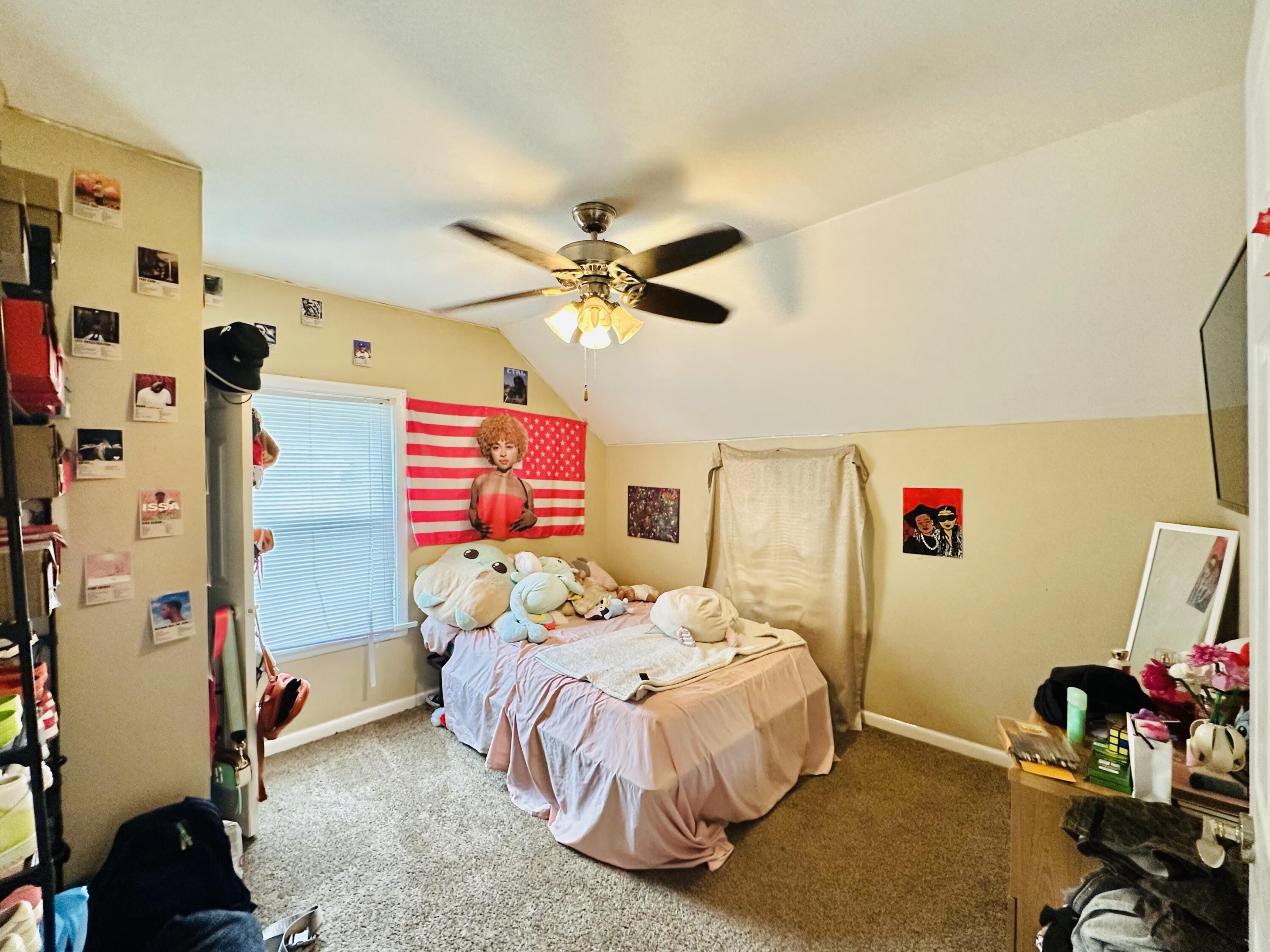 5856 Wallace Road Hammond, IN 46320 - Photo 10 of 14 a bedroom with a bed and a chandelier