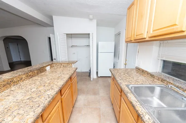 a bathroom with a toilet sink and tub