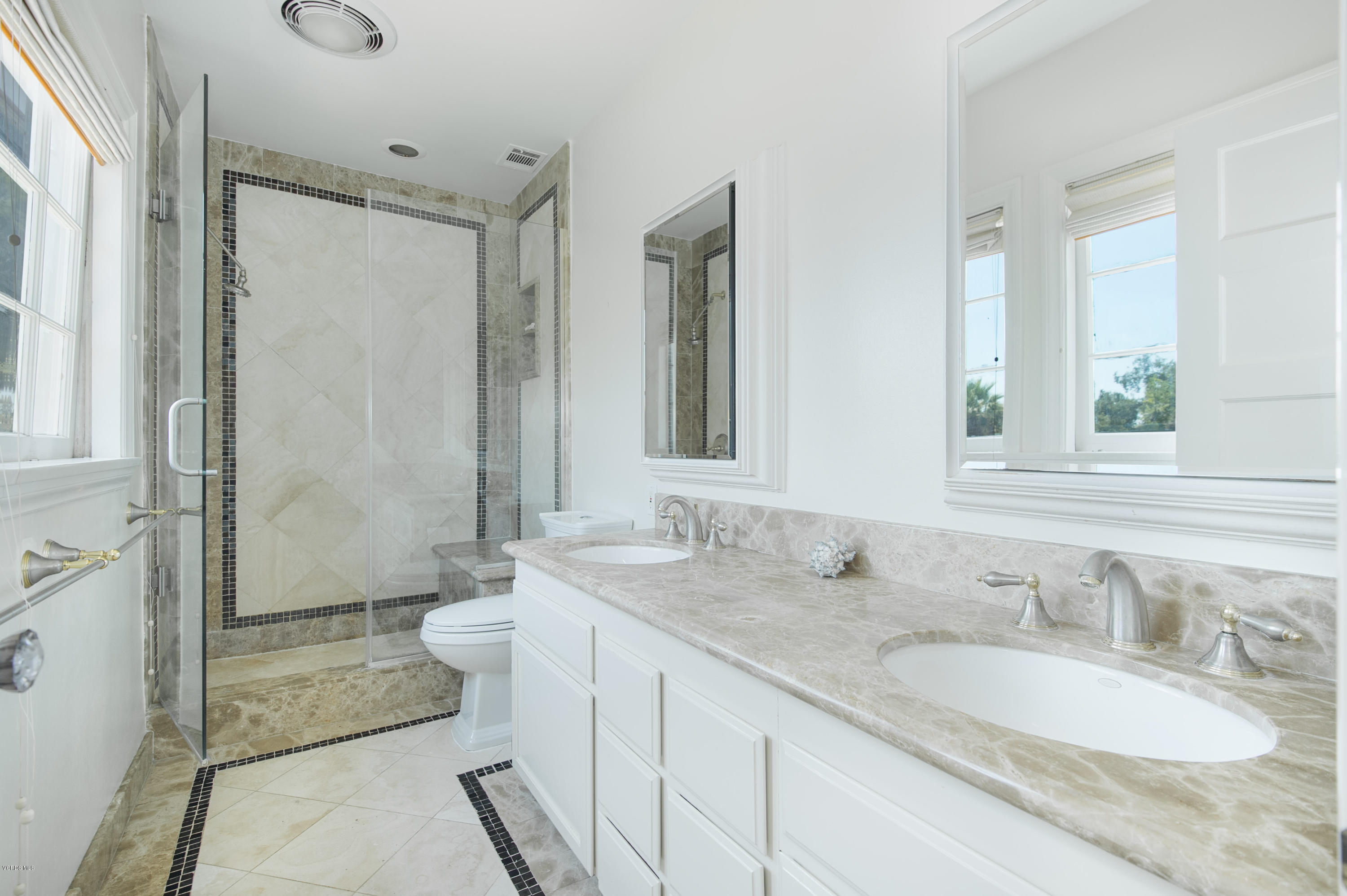 1447 Edgecliff Lane Pasadena, CA 91107 - Photo 20 of 33 a bathroom with a granite countertop double vanity sink a mirror and a shower